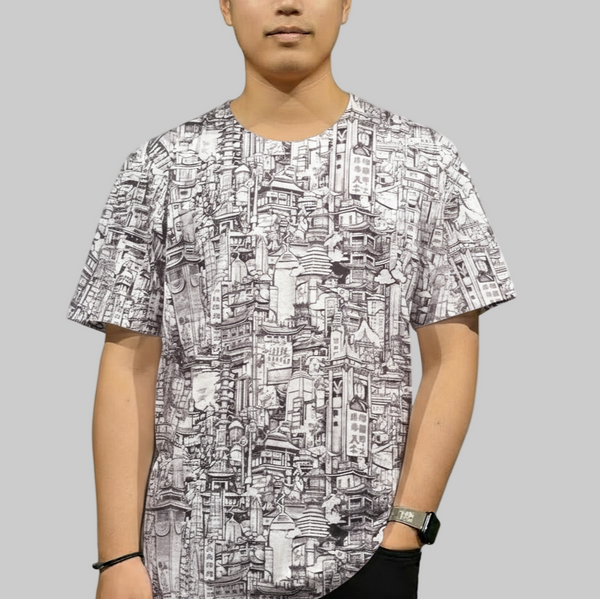 Person wearing a black and white patterned shirt on a gray background