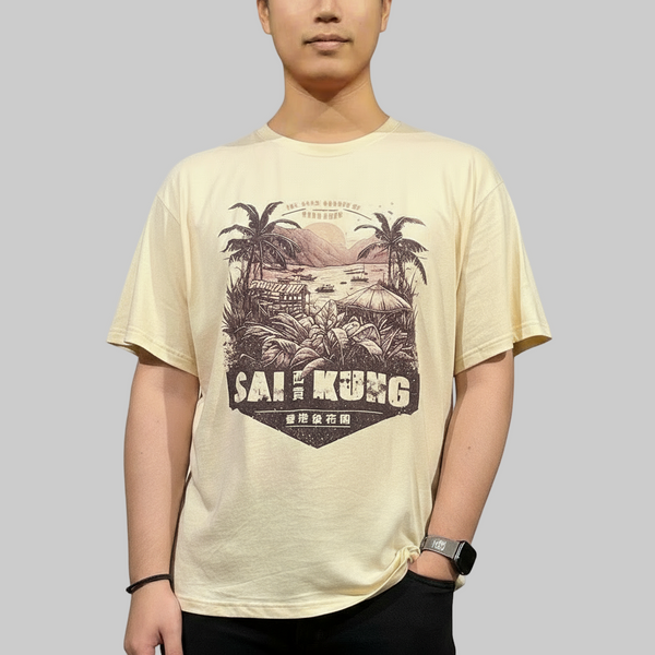Person wearing a beige t-shirt with a graphic design and text on a plain background